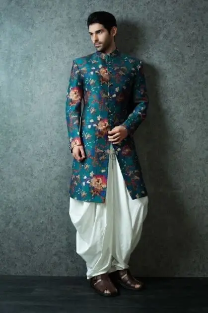 Man in a floral Indo-Western sherwani with dhoti pants